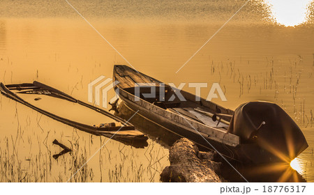 Boat on the shore lake Boat on the shore lake 18776317