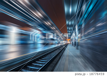 Railway station at night with motion blur effect Railway station at night with motion blur effect 18776459