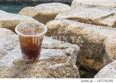 Cola with ice in a glass on stone background 18779290