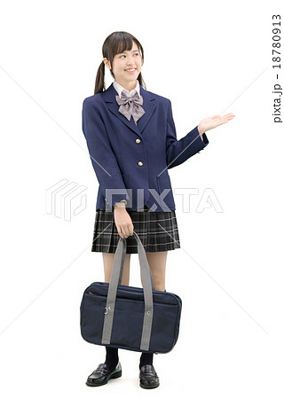 制服を着てポーズしている女子高生の全身白バックのイメージの写真素材