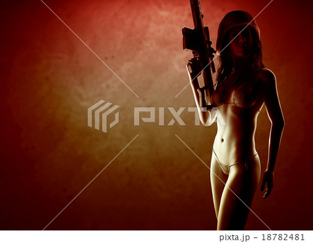 Beautiful sexy bikini woman holding army weapon 18782481