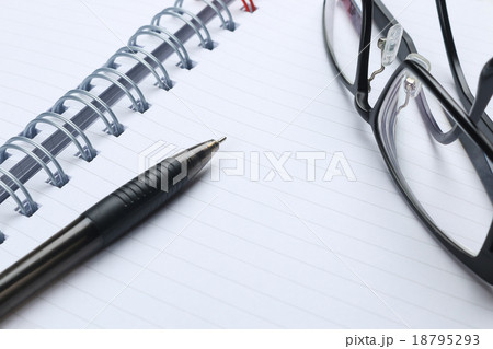 pen, notebook, glasses and financial report pen, notebook, glasses and financial report 18795293