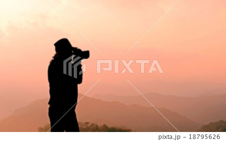 blurry silhouette photographer is taking photos 18795626