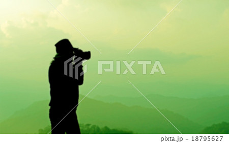 blurry silhouette photographer is taking photos 18795627