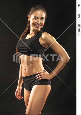 Muscular young woman athlete looking in camera on Muscular young woman athlete looking in camera on 18811176
