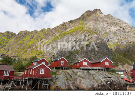 Typical red rorbu fishing hut in town of A village Typical red rorbu fishing hut in town of A village 18811537