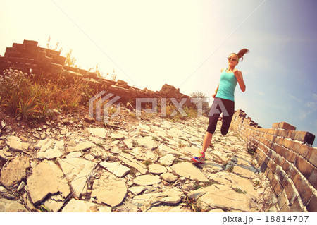 woman running on trail at chinese great wall woman running on trail at chinese great wall 18814707