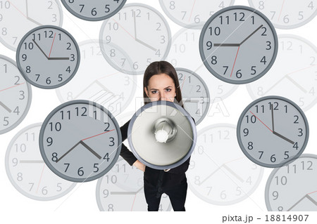 Businesswoman scream to megaphone among clocks. 18814907