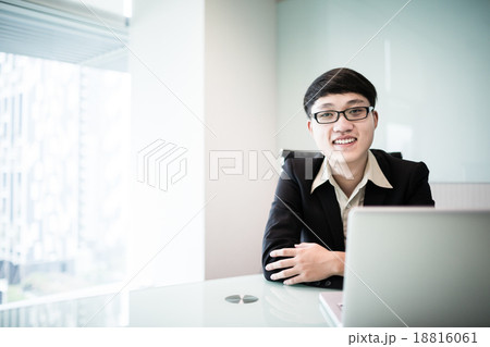 Young handsome man using laptop in his office 18816061