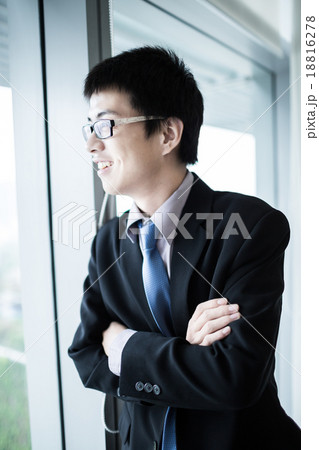 Portrait of a businessman looking at the window 18816278