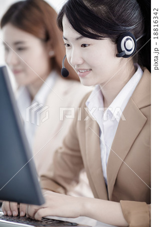 Asian women call center with phone headset 18816342