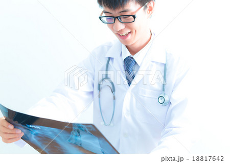 close up of male doctor holding x-ray or roentgen image 18817642