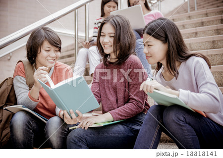 group of happy teen high school students outdoors 18818141