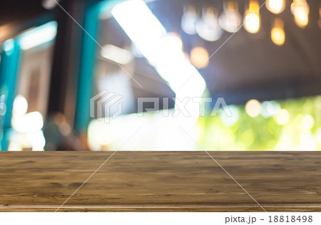 Selected focus empty brown wooden table and Coffee shop blur bac 18818498