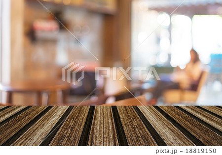 Selected focus empty brown wooden table and Coffee shop blur bac 18819150