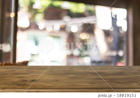 Selected focus empty brown wooden table and Coffee shop blur bac 18819151