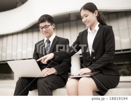 Two business colleagues in discussion Two business colleagues in discussion 18819194