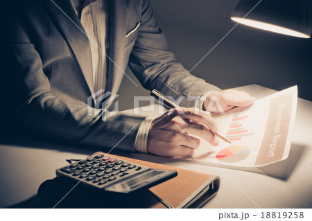 man hand with pen and business report. Accounting 18819258