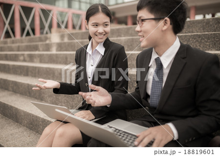 Two business colleagues in discussion Two business colleagues in discussion 18819601