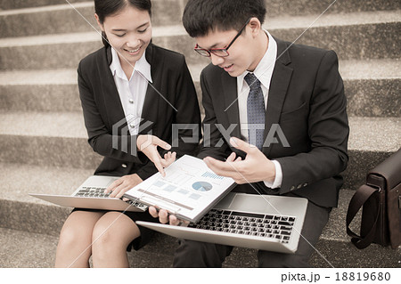 Two business colleagues in discussion Two business colleagues in discussion 18819680