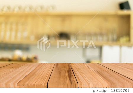 Selected focus empty brown wooden table and Coffee shop blur bac 18819705