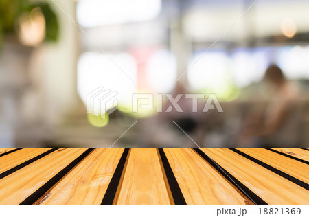 Selected focus empty brown wooden table and Coffee shop blur bac Selected focus empty brown wooden table and Coffee shop blur bac 18821369