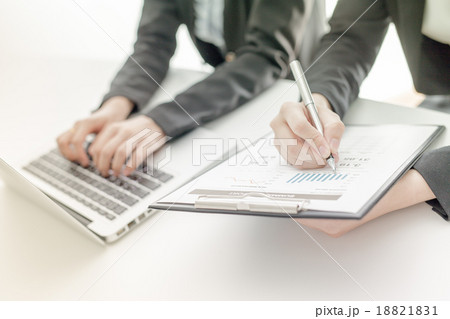 Business people discussing the charts and graphs showing the res Business people discussing the charts and graphs showing the res 18821831