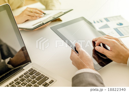 Business people discussing the charts and graphs showing the res Business people discussing the charts and graphs showing the res 18822340