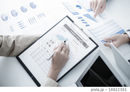 Business people discussing the charts and graphs showing the res Business people discussing the charts and graphs showing the res 18822381