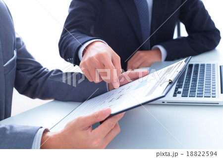 Business people discussing the charts and graphs showing the res Business people discussing the charts and graphs showing the res 18822594
