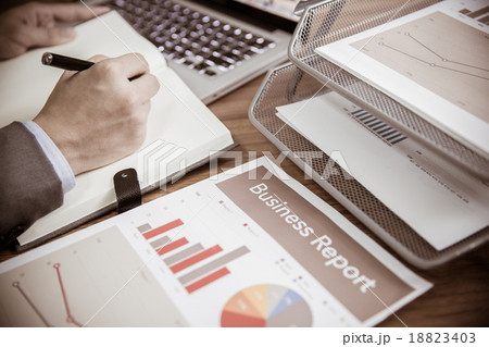 Businessman analyzing investment charts with laptop. Accounting 18823403