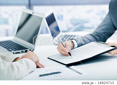 Female hand signing contract. 18824713