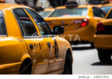 Yellow cab speeds through Times Square in New York 18825491