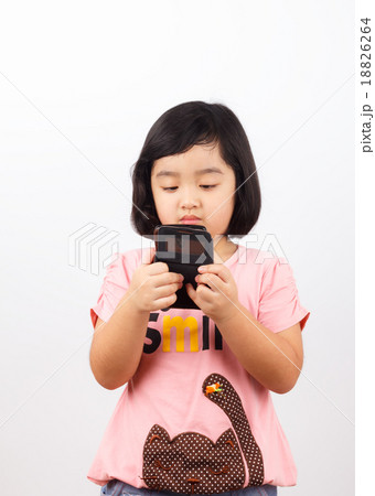 Little Asian child using her smart phone with happy face 18826264