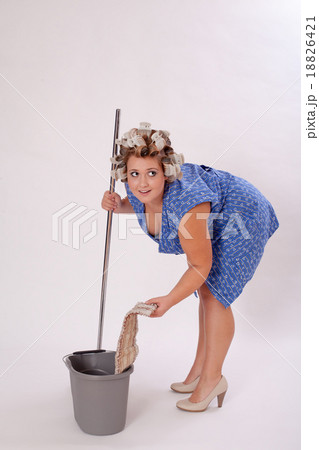 Funny Female Cleaner Holding Cleaning Materials Funny Female Cleaner Holding Cleaning Materials 18826421