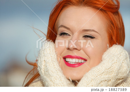 Beauty red hair woman in warm clothing outdoor Beauty red hair woman in warm clothing outdoor 18827389