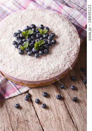 cheesecake with blueberries and mint close-up 18830122