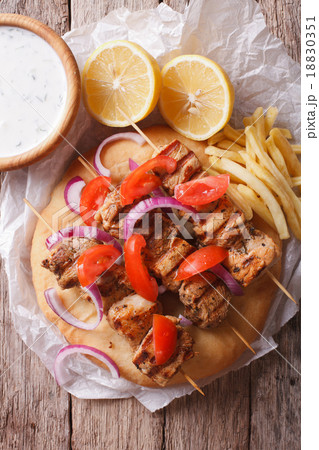 Greek souvlaki with vegetables and french fries Greek souvlaki with vegetables and french fries 18830351