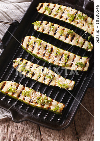 zucchini with cheese on a grill pan close-up 18830546