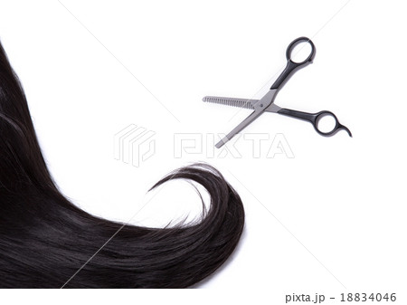 Black shiny hair strand with professional scissors 18834046