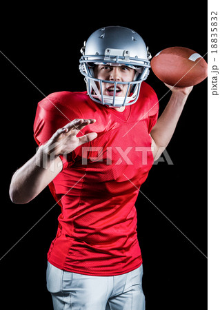 American football player throwing ball American football player throwing ball 18835832