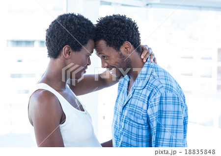 Couple touching heads while standing 18835848