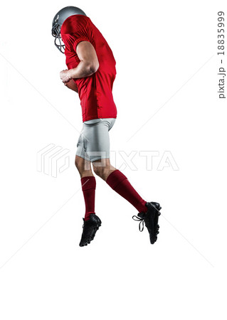 American football player in mid-air 18835999