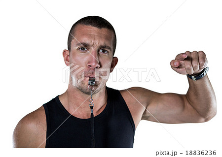 Portrait of attentive trainer blowing his whistle 18836236