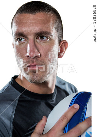 Close-up of confident rugby player holding ball 18836929