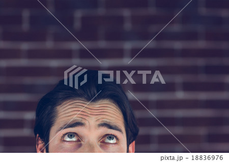 Confused man with raised eyebrows 18836976