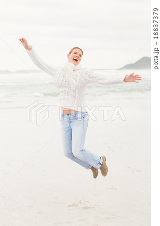 Woman jumping into the air Woman jumping into the air 18837379