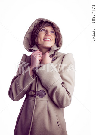 Attractive woman wearing a warm coat with hood raised 18837771