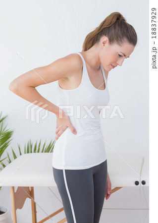 Suffering patient touching his back 18837929