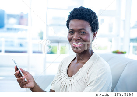 Portrait of happy woman holding cellphone 18838164